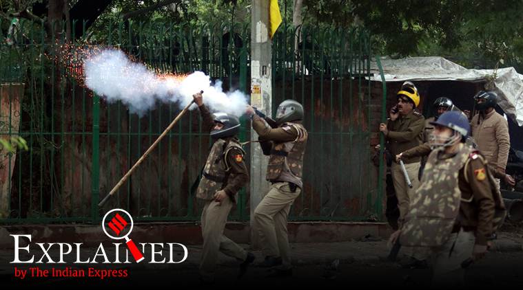Police at Jamia Millia Islamia, site of a police crackdown in December. Rioting is among the charges in cases registered by police. (Express Photo: Praveen Khanna)