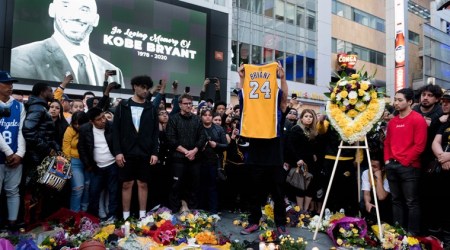 Jan 26, 2020; Los Angeles, CA, USA; Fans gather at L.A. Live in Los Angeles to pay their respects to former Los Angeles Lakers guard Kobe Bryant who died in helicopter crash on Sunday. Mandatory Credit: Sandy Hooper-USA TODAY