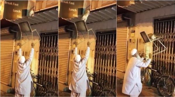 man saves cat, chachaji saves cat, elderly man rescues cat, cat rescue, man rescue cat with chair, viral videos, animal rescue videos, indian express