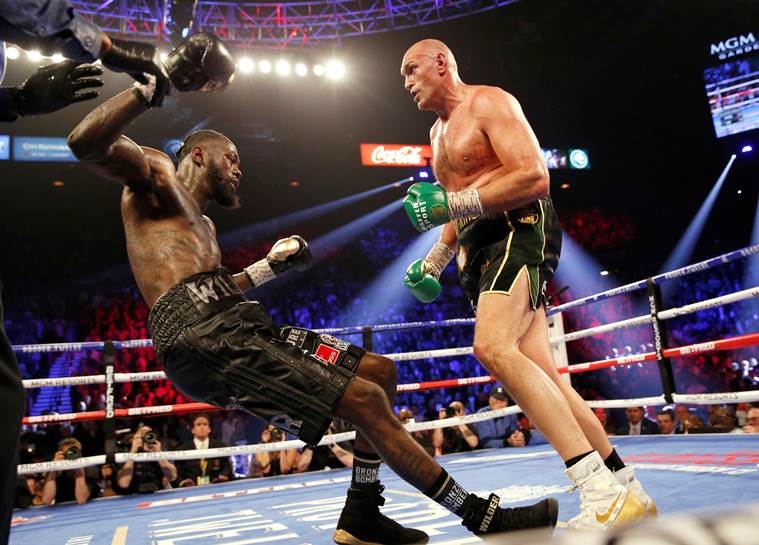 Tyson Fury knocks down Deontay Wilder