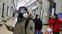 A man wears a face mask at a metro station in Beijing as the country is hit by an outbreak of the novel coronavirus coronavirus china, coronavirus china shutdown, china coronavirus spread, shutdown wuhan, china coronavirus resitrictions, covid 19 china, indian express