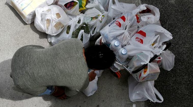 In China's locked-down coronavirus city, grocery delivery is a lifeline