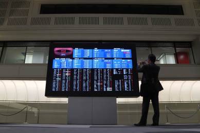 GLOBAL MARKETS - Asia shares jump but pandemic hangs heavy over outlook, Asian stock markets, MSCI ex-Japan starts higher on Tuesday, Nikkei rises too, Signs of peaking in coronavirus outbreak helping sentiment, Confidence tempered by fears of global recession, Investors eye Chinese trade data, corporate results, global market news, world market news update, business news india, indian express business news