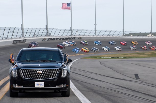 US President Donald Trump and First Lady Melania Trump ride in the Presidential limousine as they take a pace lap ahead of the start of the Daytona 500 Nascar race at Daytona International Speedway in Daytona Beach, Florida