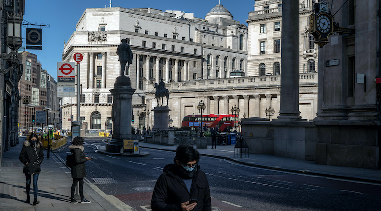 Pedestrians are scarce in the City of London, the financial district, during what is normally the morning rush hour on Monday, March 23, 2020.