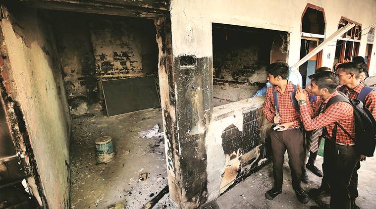 Amid burnt walls, furniture, students take exam at riot-hit school in ...