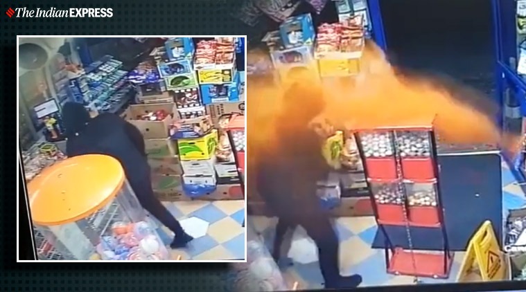Shopkeeper throws chilli powder at armed robber, Shopkeeper throws chilli powder to fight off armed robber, Shopkeeper, chilli powder, robbery videos, UK, Trending news, Indian Express news