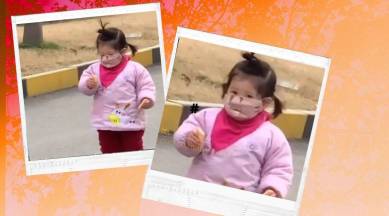 China, coronavirus, COVID-19, coronavirus cause, coronavirus cure, girl with mask biscuits, china funny video, trending, indian express, indian express news