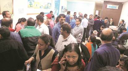 In pics: Customers of Yes Bank line up outside ATMs for cash