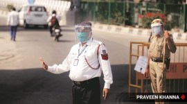 Policemen at work wearing a face shield in New Delhi on Monday.