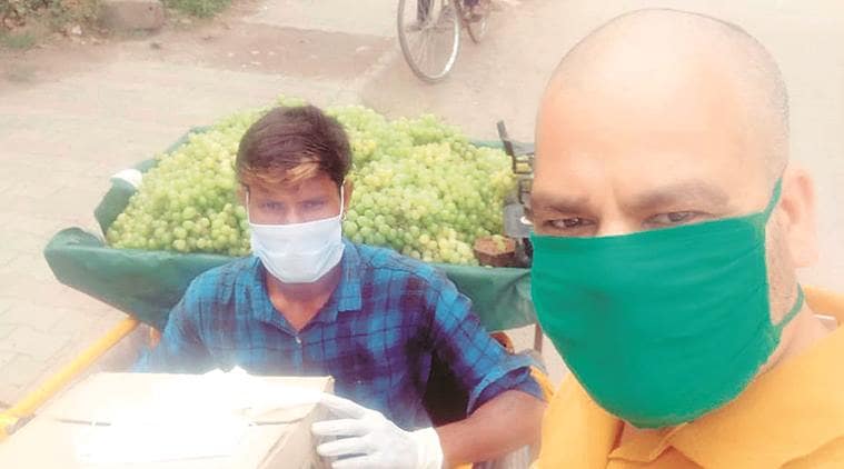 Youth sells frtuit, Fruit sellar, wheelchair, Coronavirus outbreak, India lockdown, Indian express news