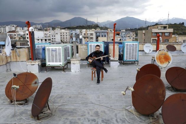 Coronavirus lockdown Iran, coronavirus mandatory self isolation Iran, iran musicians perform rooftops coronavirus, iran musicians coronavirus, sel isoation coronavirus, quarantine coronavirus, what do do at home, work from home, stay at home, things to do while at home, skills while at home, new hobbies to learn at home, coronavirus news, coronavirus world news, coronavirus latest news,Iran coronavirus case, Iran coronavirus deaths, indian express news