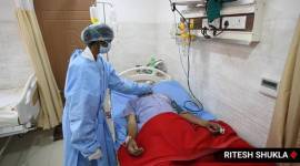Shajapur hospital, patient tied to bed, madhya pradesh, shajapur hospital, indian express