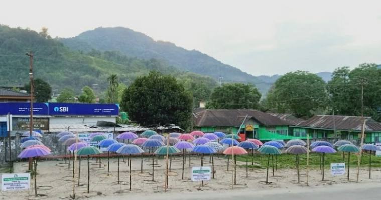 Arunachal Pradesh, Aalo, Social Distancing, Umbrella, Dr Jumge Padu, COVID-19, Coronavirus, india Lockdown, arunachal pradesh news, indian express