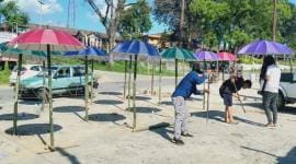 Arunachal Pradesh, Aalo, Social Distancing, Umbrella, Dr Jumge Padu, COVID-19, Coronavirus, india Lockdown, arunachal pradesh news, indian express