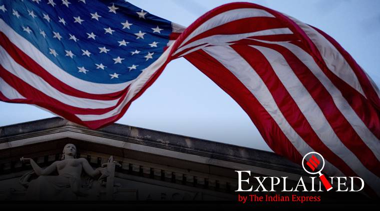 FILE - In this March 22, 2019 file photo, an American flag flies outside the Department of Justice in Washington. The Department of Justice says in a statement that hackers have been attempting to obtain intellectual property and public health data related to vaccines, treatments, and testing. (AP Photo/Andrew Harnik)