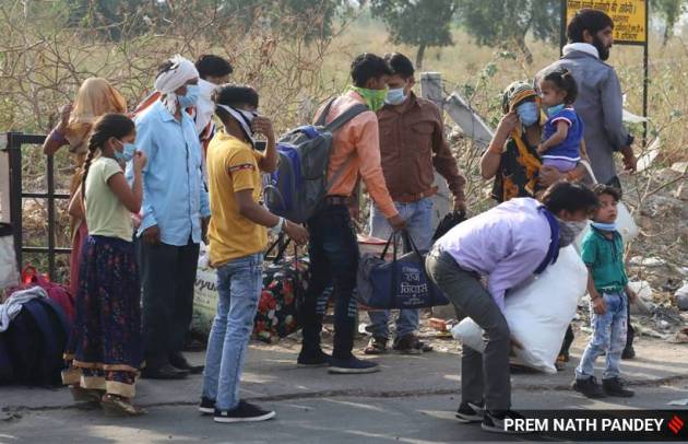 Migrant workers continue to leave Delhi – on foot and trains | India ...