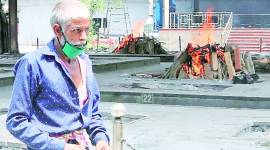 crematorium Stretched ambulance workers, lonely priest, PPE shop as Nigam Bodh adapts to Covid