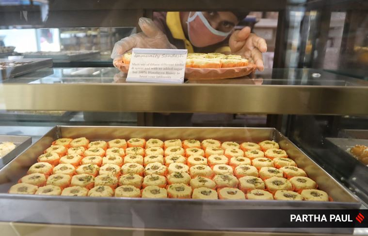 immunity sandesh, kolkata immunity sandesh, Balaram Mullick and Radharaman Mullick, kolkata corona theme misti, kolkata sweets, viral news, bengal coronavirus updates, indian express