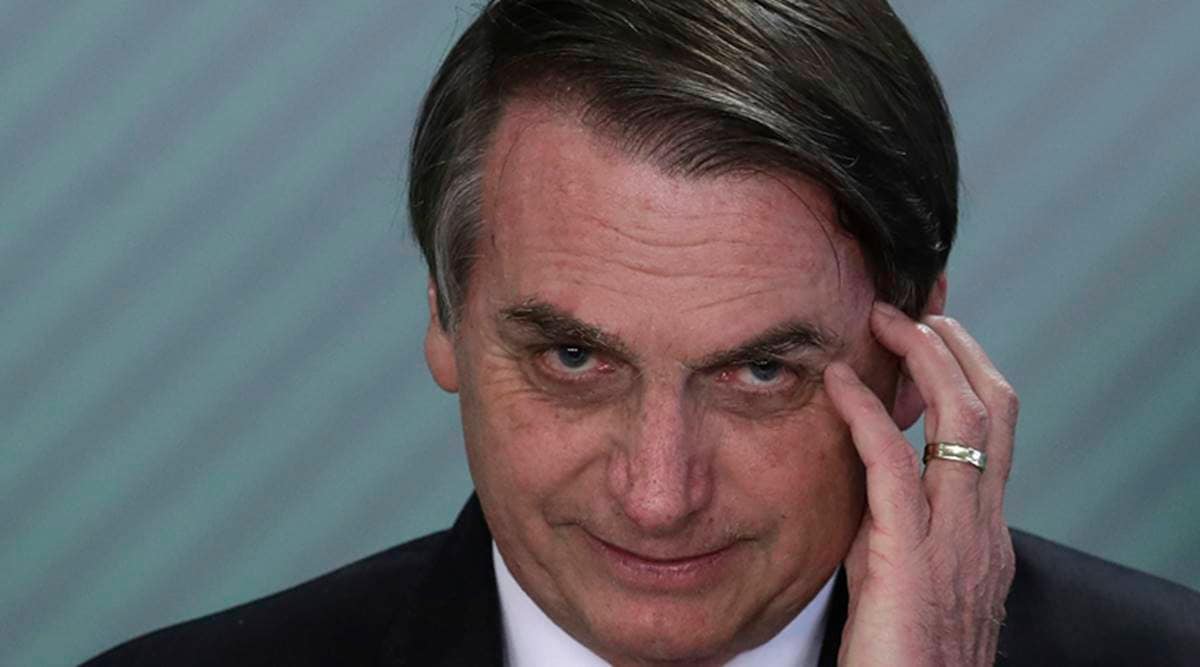 Brazil President Bolsonaro threatens to punch reporter in face over corruption question