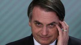 Brazil President Bolsonaro threatens to punch reporter in face over corruption question