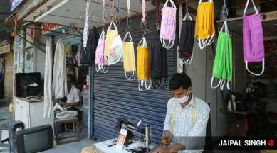 Amit working as a tailor since last 10 years at Sector 9 Rehri Market in Panchkula, now stitching masks after lockdown due to no work of Interlock, Saree Fall, Alteration etc. Earlier he earns Rupees 1500-2000 daily but now after lockdown he earns only Rupees 500-600/-, one day a customer advised him to make masks and he started it and sell Rupees 40/- per mask. Picture clicked at 3:00 p.m. in Panchkula on Monday, June 15 2020. Express photo by Jaipal Singh