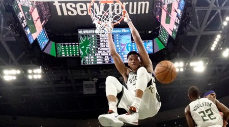 FILE - In this Feb. 22, 2020, file photo, Milwaukee Bucks' Giannis Antetokounmpo dunks during the first half of an NBA basketball game against the Philadelphia 76ers in Milwaukee. The Bucks believe they can build on the momentum they established while producing the NBA’s best record before the pandemic-imposed hiatus. (AP Photo/Morry Gash, File)