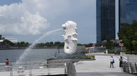 The Merlion Statue stands in a near-empty Merlion Park in Singapore on Monday, July 6, 2020. Prime Minister Lee Hsien Loong vowed to hand over Singapore intact and in good working order to the next generation of leaders, predicting the coronavirus crisis will weigh heavily on the nations economy for at least a year. Photographer: Wei Leng Tay/Bloomberg