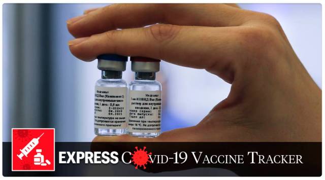 An employee shows a new vaccine at the Nikolai Gamaleya National Center of Epidemiology and Microbiology in Moscow, Russia (AP)