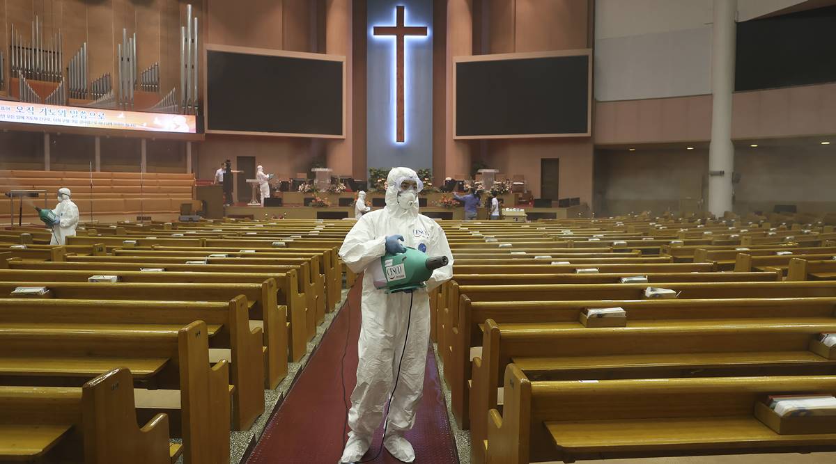 Public officials disinfect to curb the spread of the coronavirus at the Yoido Full Gospel Church in Seoul, South Korea (AP)