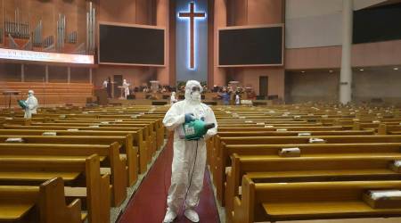 Public officials disinfect to curb the spread of the coronavirus at the Yoido Full Gospel Church in Seoul, South Korea (AP)