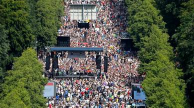 People gather for a demonstration with the slogan ‚The end of the pandemic - freedom day' - against coronavirus restrictions in Berlin, Germany, Saturday, Aug. 1, 2020. It comes amid increasing concern about an upturn in infections in Germany. (AP Photo/Markus Schreiber)