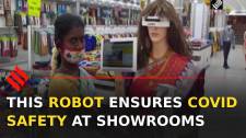 Humanoid robot ensures COVID precautions at cloth-stores