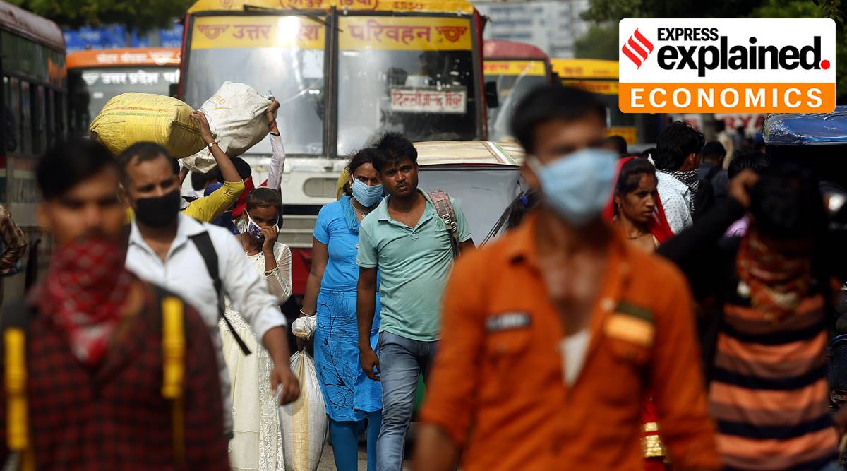 Migrant labourers return to New Delhi from parts of Uttar Pradesh on August 10, 2020. In large numbers, workers had left the city due to the Covid-19 lockdown. (Express Photo: Praveen Khanna)