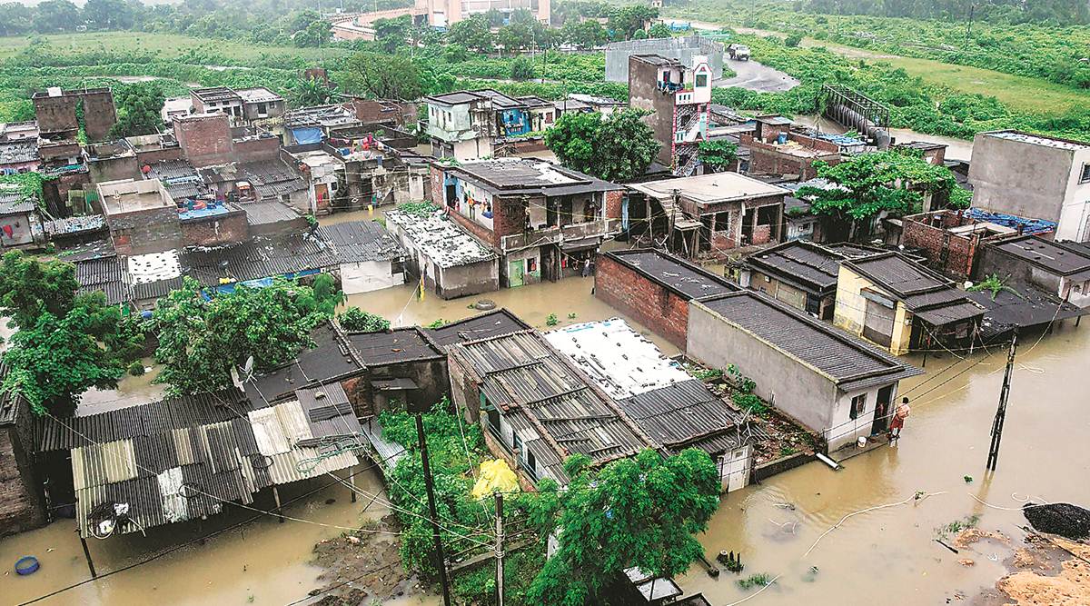 Flooded streets and submerged houses after heavy rainfall at Bhestan in Surat on Friday. (PTI)