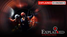 FILE PHOTO: Workers are seen through a pipe at the construction site of the Nord Stream 2 gas pipeline in Russia PNGRB, PNGRB rules for gas companies, Delhi Indraprastha Gas Ltd, Mahanagar Gas Ltd Mumbai, Gujarat Gas Ltd, gas distribution, gas pipeline infrastructure rules, gas distribution infrastructure, Indian Express