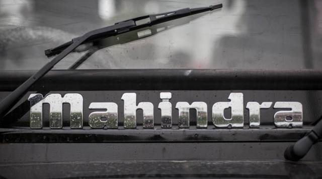 The Mahindra & Mahindra Ltd. logo is displayed on a Thar sport utility vehicle (SUV) at a dealership in New Delhi, India, on Thursday, July 26, 2012. (Photographer: Sanjit Das/Bloomberg)