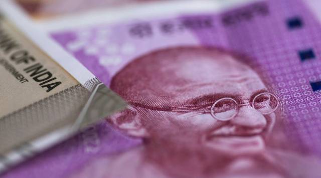 The portrait of Mahatma Gandhi is displayed on an Indian 2,000 rupee banknote in an arranged photograph in Bangkok, Thailand, on Wednesday, Sept. 12, 2018. (Photographer: Brent Lewin/Bloomberg)