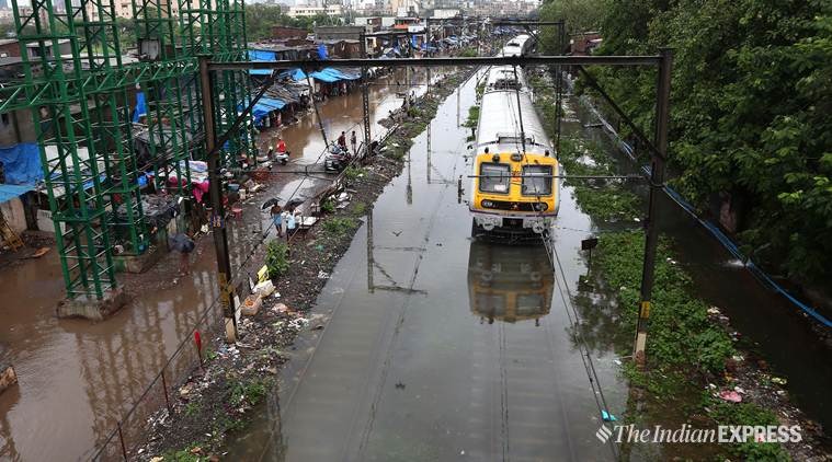 mumbai monsoon, mumbai rains, mumbai water logging, mumbai essential trains, mumbai essential trains stranded, indian express news