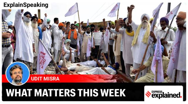 Farmers shout slogans as they block a railway track protesting against the new farm bills, at Devi Dass Pura village, about 20 kilometers from Amritsar (AP)