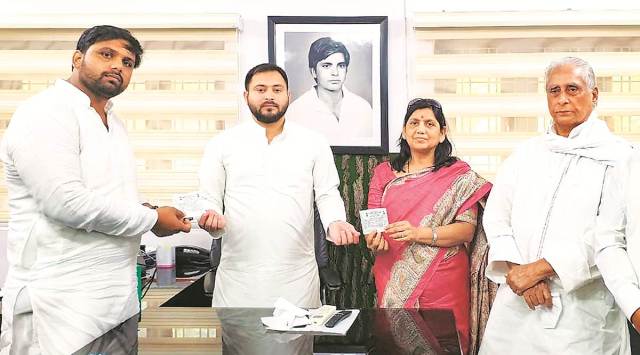 RJD leader Tejashwi Yadav with Lovely Anand and her son Chetan Anand, in Patna. (PTI)
