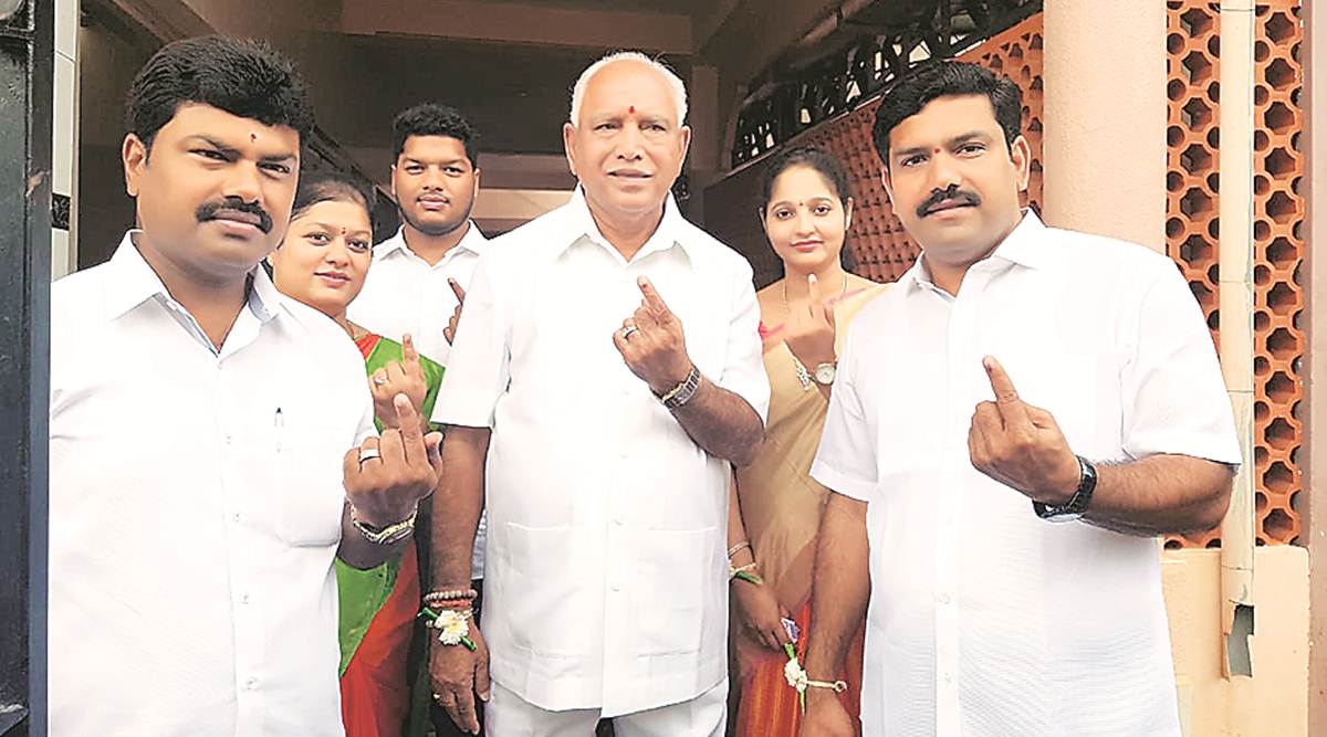Yediyurappa with his sons B Y Vijayendra (to his right) after the 2018 assembly polls.