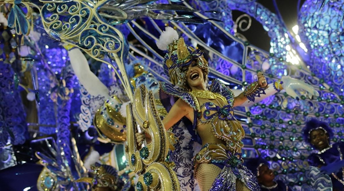 Performer from Beija Flor samba school parades on a float during the Carnival celebrations at the Sambadrome in Rio de Janeiro, Brazil, 2016. (AP Photo/Leo Correa)