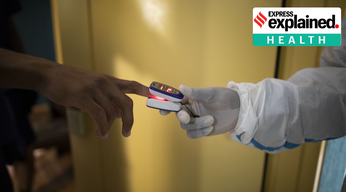 A doctor takes the heart rate and blood oxygenation readings of an asymptomatic Covid-19 patient. (AP Photo/Ariana Cubillos/Image used for representational purposes)