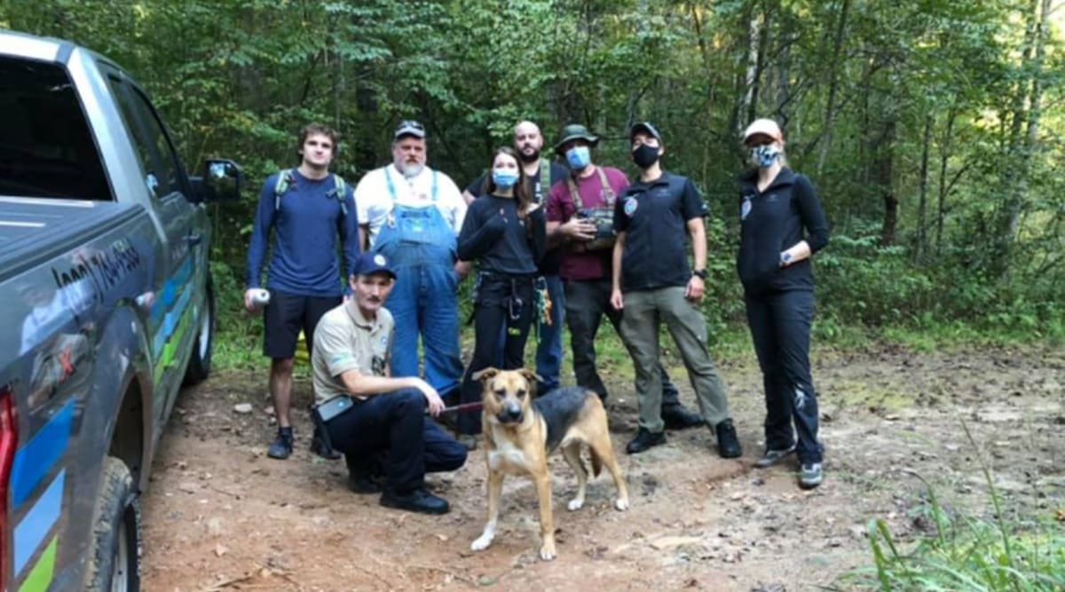 Rescuers climb down 30foot pit to rescue dog trapped there for days