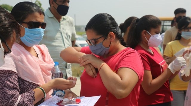 NEET 2020: Students appeared at the exam following strict COVID-19 guidelines. Express Photo 