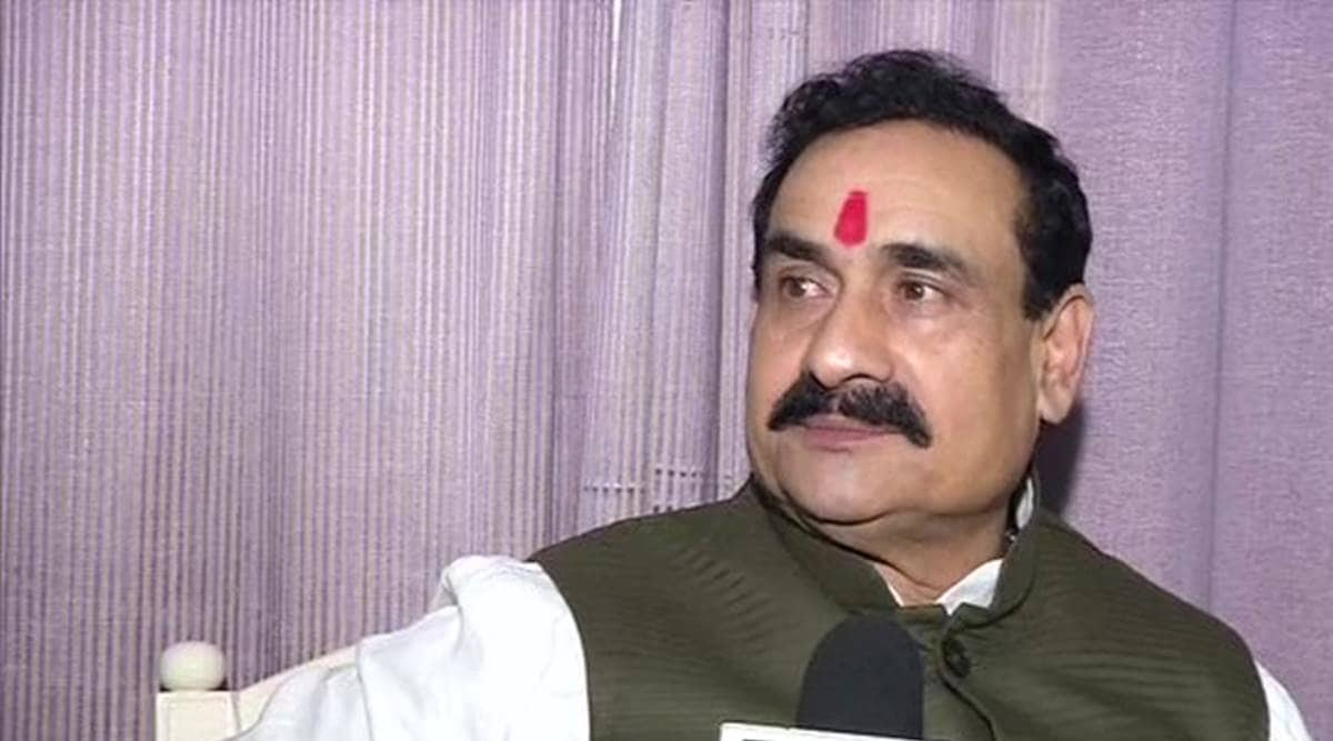 MP minister mask, Narottam Mishra, Madhya Pradesh Home Minister Narottam Mishra, MP congress, BJP leader denies to wear mask, MP coronavirus cases, Indian express