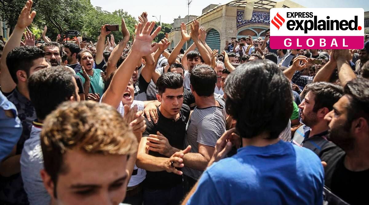 In this June 25, 2018 file photo, a group of protesters chant slogans after Iran broadcast the televised confession of the wrestler facing the death penalty. (Iranian Labor News Agency via AP, File)
