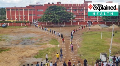 Candidates stand in a queue at an examination centre before appearing in the National Eligibility-cum-Entrance Test (NEET) during Unlock 4. 0, in Bhubaneswar, Sunday, Sept. 13, 2020. (PTI Photo)