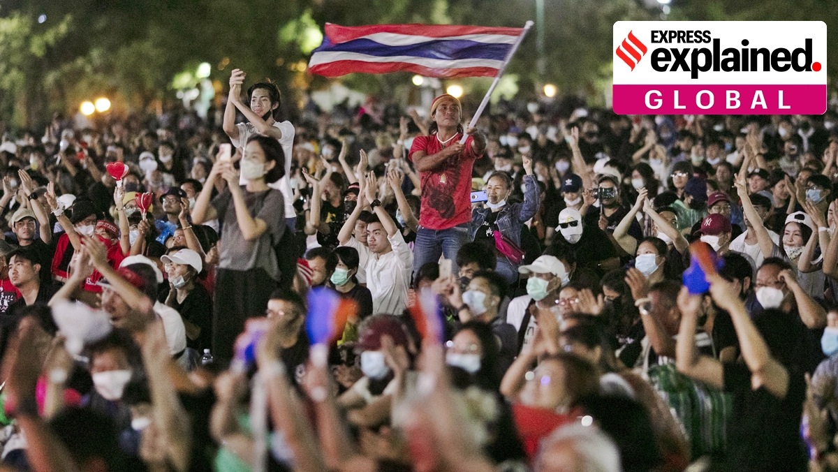Pro-democracy protesters wave the national flag at the Sanam Luang field during a protest in Bangkok, Thailand, Saturday, Sept. 19, 2020 (AP)